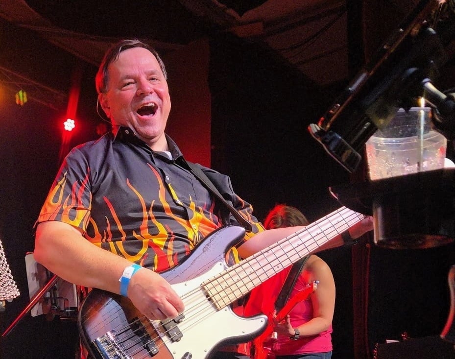 Paul playing bass for speaker page-1